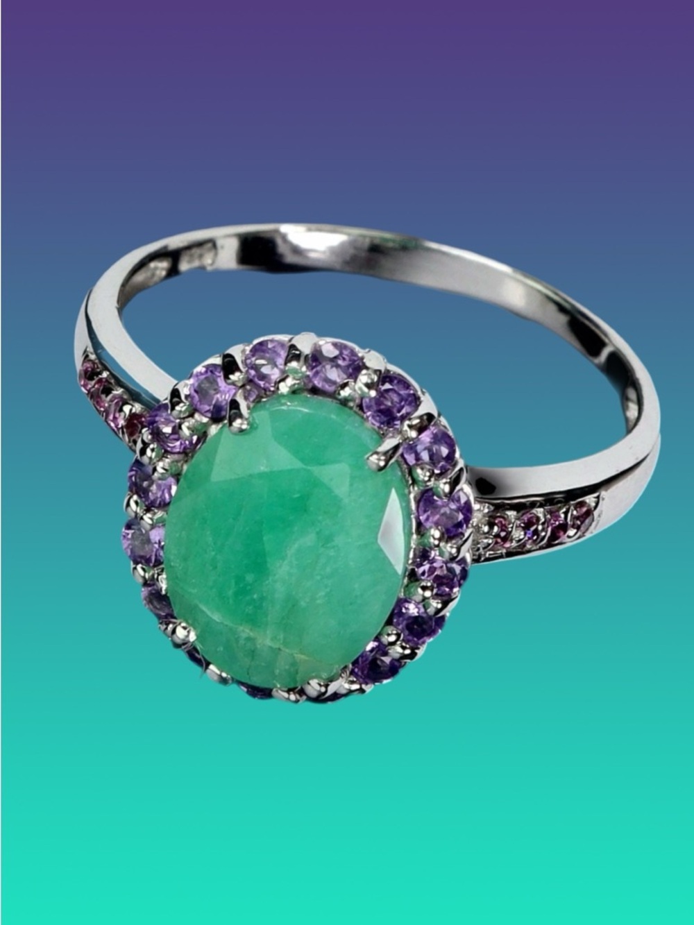 Genuine 8 mm by 10mm Emerald- Halo Ring with Genuine Amethysts
See Video - Picture 5 of 7